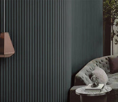 Modern interior with a gray sofa and striped wall.