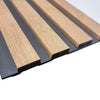 Wooden strip with black base on a white background