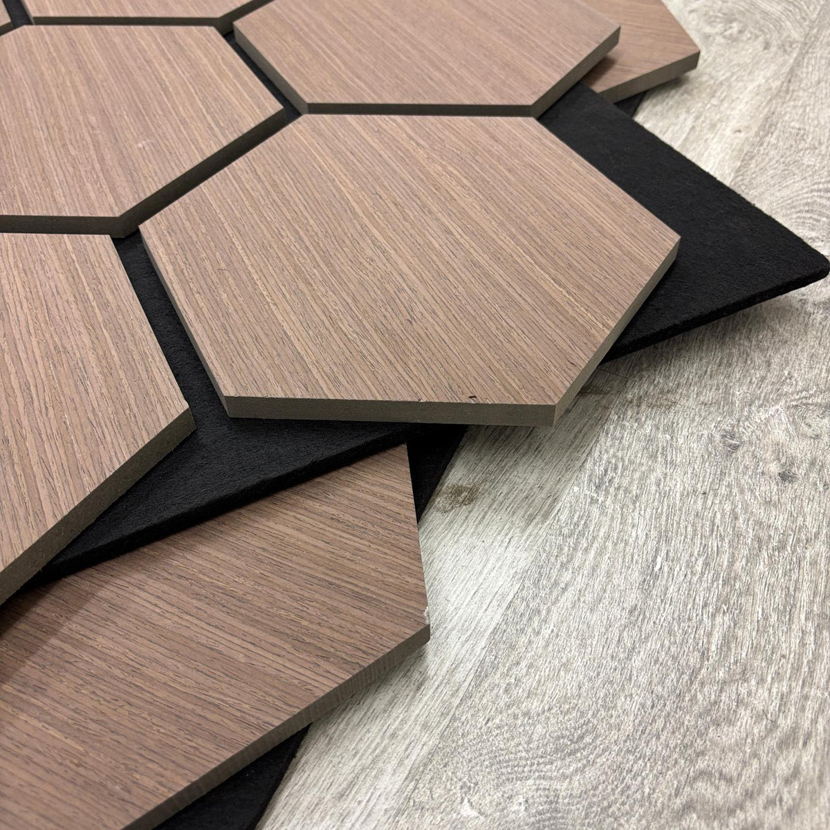 Hexagonal wooden tiles on a wooden surface